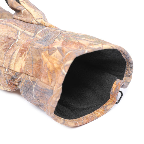 Camouflage-patterned dog house with black interior on a white background