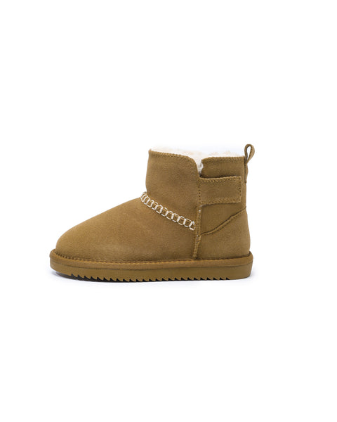 Tan suede boot with white fur lining on a white background